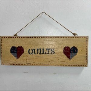 Vintage wood quilts sign with two hearts